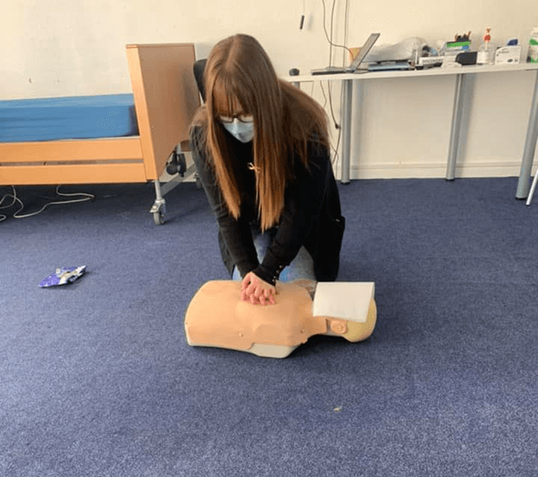 team-member-learning-how-to-perform-CPR